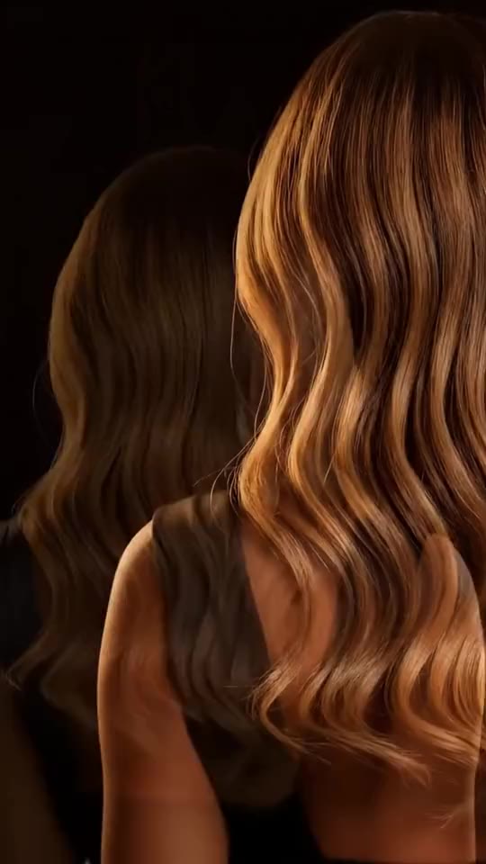 Melena con ondas iluminada en tonos cálidos; imagen conceptual generada con IA